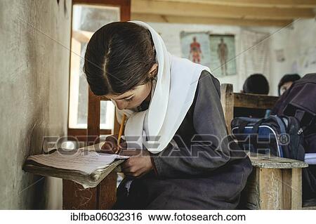 Girl writes in a notebook on a school desk, Potokh Primary School, Potokh, Wakhan Corridor, Afghanistan, Asia View Large Photo Image Stock Photograph - Girl writes in a notebook on a school desk, Potokh Primary School, Potokh, Wakhan Corridor, Afghanistan, Asia. Fotosearch