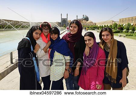 Stock Photograph - Girls posing on Imam Square, Meydan-e Naqsh-e Jahan, Isfahan, Iran, Asia. Fotosearch