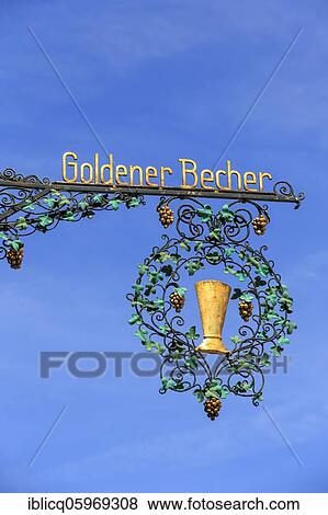 Golden cup, nose shield of a restaurant, Rottweil, Baden-Württemberg, Germany, Europe View Large Photo Image Stock Photo - Golden cup, nose shield of a restaurant, Rottweil, Baden-Württemberg, Germany, Europe. Fotosearch