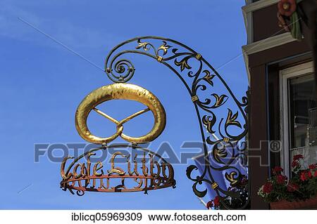 Golden pretzel, nose tag of a café, Rottweil, Baden-Württemberg, Germany, Europe View Large Photo Image Stock Photo - Golden pretzel, nose tag of a café, Rottweil, Baden-Württemberg, Germany, Europe. Fotosearch