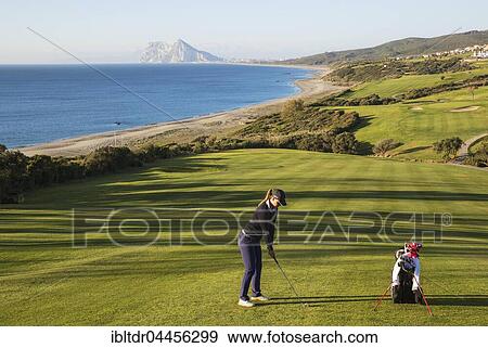 Golfer at La Alcaidesa Golf Resort with Mediterranean Sea and Rock of Gibraltar, Cádiz, Andalusia, Spain, Europe View Large Photo Image Stock Photo - Golfer at La Alcaidesa Golf Resort with Mediterranean Sea and Rock of Gibraltar, Cádiz, Andalusia, Spain, Europe. Fotosearch