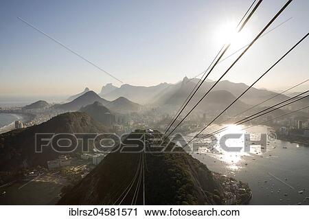 Stock Image - Gondola to the Sugar Loaf Mountain with views of the city and surrounding area, Rio de Janeiro, Brazil, South America. Fotosearch