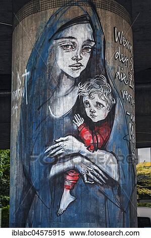 Graffiti on concrete pillars, refugee mother with child, Canditplatz, Munich, Bavaria, Germany, Europe View Large Photo Image Stock Photography - Graffiti on concrete pillars, refugee mother with child, Canditplatz, Munich, Bavaria, Germany, Europe. Fotosearch