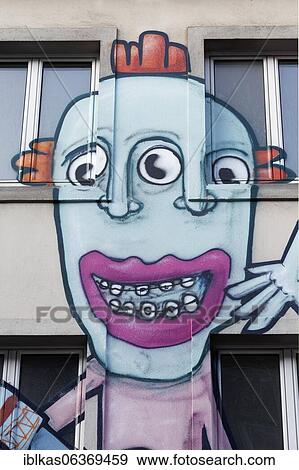 Graffito, bizarre children's face with three eyes and braces, Düsseldorf, North Rhine-Westphalia, Germany, Europe View Large Photo Image Stock Photo - Graffito, bizarre children's face with three eyes and braces, Düsseldorf, North Rhine-Westphalia, Germany, Europe. Fotosearch
