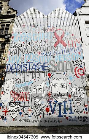 Stock Photography - Graffito, House painting for AIDS prevention, Marché aux Herbes, Grasmarkt, Brussels, Belgium, Europe. Fotosearch