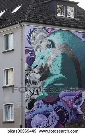 Stock Photo - Graffito Lion in Leap, mural by streetart artist Cokyone, Düsseldorf, North Rhine-Westphalia, Germany, Europe. Fotosearch