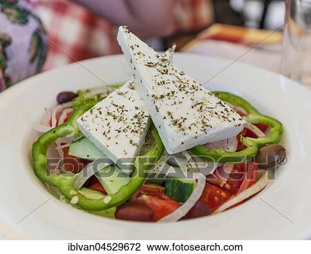 Greek salad with tomatoes, peppers, feta cheese, cucumbers and olives View Large Photo Image Stock Image - Greek salad with tomatoes, peppers, feta cheese, cucumbers and olives. Fotosearch