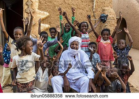 Stock Photo - Group of young children cheering, Agadez, Niger, Africa. Fotosearch