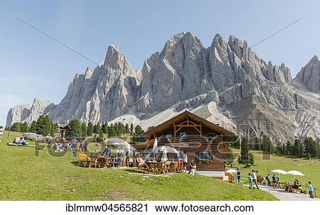 Stock Image - Gschnagenhardt Alm in the Villnöß valley below Geisler peaks, behind the Geisler group, Sass Rigais, Dolomites, South Tyrol, Italy, Europe. Fotosearch