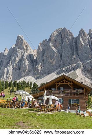 Stock Image - Gschnagenhardt Alm in the Villnöß valley below Geisler peaks, Geisler group behind, Sass Rigais, Dolomites, South Tyrol, Italy, Europe. Fotosearch
