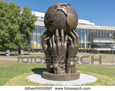 Hands carrying globe, monument from Ali Salhab, at back conference center of 1973, Ariana Park, Palais des Nations, European headquarters of the United Nations, UNOG, Geneva, Switzerland, Europe View Large Photo Image Stock Photo - Hands carrying globe, monument from Ali Salhab, at back conference center of 1973, Ariana Park, Palais des Nations, European headquarters of the United Nations, UNOG, Geneva, Switzerland, Europe. Fotosearch
