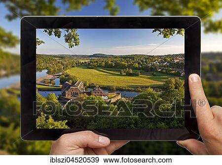 Hands holding tablet pc, with photo of Ruhr valley, Witten, Ruhr area, North Rhine-Westphalia, Germany, Europe View Large Photo Image Stock Photo - Hands holding tablet pc, with photo of Ruhr valley, Witten, Ruhr area, North Rhine-Westphalia, Germany, Europe. Fotosearch