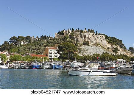 Harbor, at back castle Chateau de Cassis, Cassis, Bouches-du-Rhone, Provence-Alpes-Côte d'Azur, France, Europe View Large Photo Image Stock Photo - Harbor, at back castle Chateau de Cassis, Cassis, Bouches-du-Rhone, Provence-Alpes-Côte d'Azur, France, Europe. Fotosearch