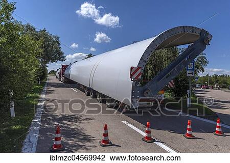 Stock Image - Heavy-duty lorry with windmill sections on a motorway rest area on the A 24, Mecklenburg-Western Pomerania, Germany, Europe. Fotosearch