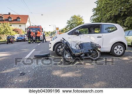Stock Photograph - Heavy road accident, Simson scooter crashing in car, police recording accident, Germany, Europe. Fotosearch