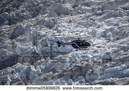 Helicopter over glacier, Glacier de Bossons, Alpine rescue, mountain rescue, Chamonix, Haute-Savoie, France, Europe View Large Photo Image Stock Photograph - Helicopter over glacier, Glacier de Bossons, Alpine rescue, mountain rescue, Chamonix, Haute-Savoie, France, Europe. Fotosearch