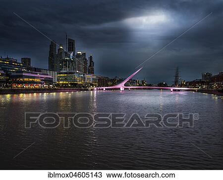 High-rise buildings at the South Dock with bridge Puente de la Mujer over the river Río de la Plata, at night, Puerto Madero, Buenos Aires, Argentina, South America View Large Photo Image Stock Image - High-rise buildings at the South Dock with bridge Puente de la Mujer over the river Río de la Plata, at night, Puerto Madero, Buenos Aires, Argentina, South America. Fotosearch