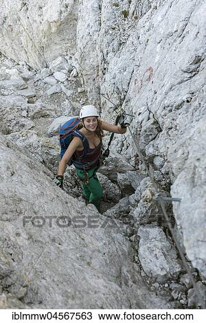 Hiker climbs the Santner via ferrata, Rosengarten Group, Dolomites, South Tyrol, Trentino-Alto Adige, Italy, Europe View Large Photo Image Stock Image - Hiker climbs the Santner via ferrata, Rosengarten Group, Dolomites, South Tyrol, Trentino-Alto Adige, Italy, Europe. Fotosearch
