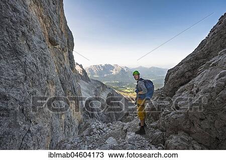 Hiker in the Santner via ferrata, rose garden group, view of the Latemar Group, Dolomites, South Tyrol, Trentino-Alto Adige, Italy, Europe View Large Photo Image Stock Image - Hiker in the Santner via ferrata, rose garden group, view of the Latemar Group, Dolomites, South Tyrol, Trentino-Alto Adige, Italy, Europe. Fotosearch