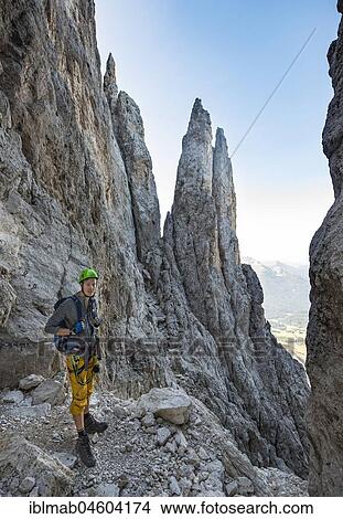 Hiker on the Santner via ferrata, Rosengarten Group, Dolomites, South Tyrol, Trentino-Alto Adige, Italy, Europe View Large Photo Image Picture - Hiker on the Santner via ferrata, Rosengarten Group, Dolomites, South Tyrol, Trentino-Alto Adige, Italy, Europe. Fotosearch