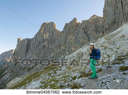 Stock Image - Hiker on the Santner via ferrata, Rosengarten Group, Dolomites, South Tyrol, Trentino-Alto Adige, Italy, Europe. Fotosearch