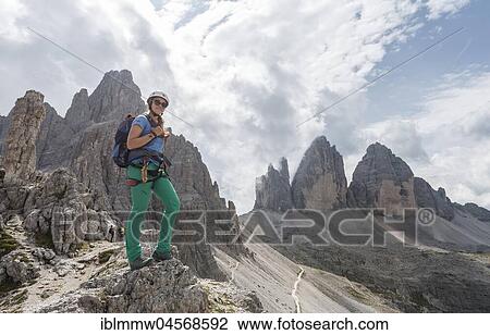 Stock Image - Hiker on the via ferrata to Paternkofel, Northern walls of the Three Peaks, Sesto Dolomites, South Tyrol, Trentino-South Tyrol, Alto-Adige, Italy, Europe. Fotosearch