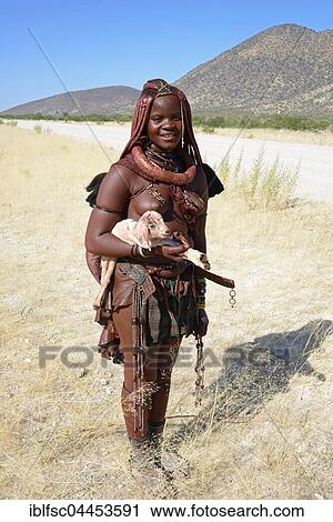 Himba woman with small goat, Kaokoveld, Namibia, Africa View Large Photo Image Stock Image - Himba woman with small goat, Kaokoveld, Namibia, Africa. Fotosearch