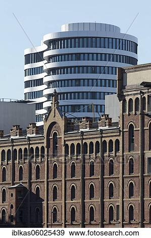 Stock Photo - Historic warehouse building and modern office tower, Trivago Campus, Media Harbour Düsseldorf, North Rhine-Westphalia, Germany, Europe. Fotosearch