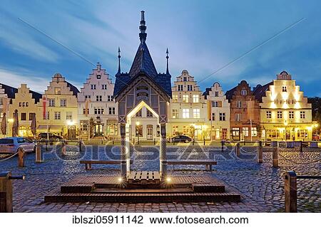 Historical fountain house on the market place in front of gabled houses in the evening, Friedrichstadt, North Frisia, Schleswig-Holstein, Germany, Europe View Large Photo Image Stock Image - Historical fountain house on the market place in front of gabled houses in the evening, Friedrichstadt, North Frisia, Schleswig-Holstein, Germany, Europe. Fotosearch