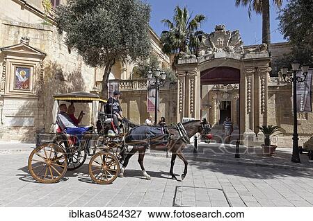 Stock Photo - Horse carriage in front of Palazzo Vilhena, Natural History Museum, Mdina, Malta, Europe. Fotosearch