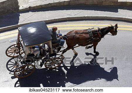 Horse carriage on the road, Valletta, Malta, Europe View Large Photo Image Stock Photo - Horse carriage on the road, Valletta, Malta, Europe. Fotosearch