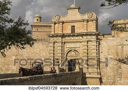 Horse-drawn carriage in front of city gate, Mdina, Malta, Europe View Large Photo Image Stock Photo - Horse-drawn carriage in front of city gate, Mdina, Malta, Europe. Fotosearch