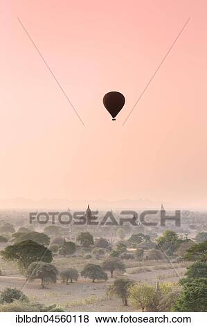 Stock Photo - Hot air balloon over Bagan temples at sunrise, Bagan, Division Mandalay, Myanmar, Asia. Fotosearch