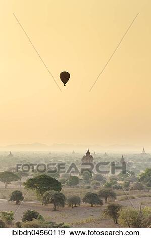 Stock Photo - Hot air balloon over Bagan temples at sunrise, Bagan, Division Mandalay, Myanmar, Asia. Fotosearch