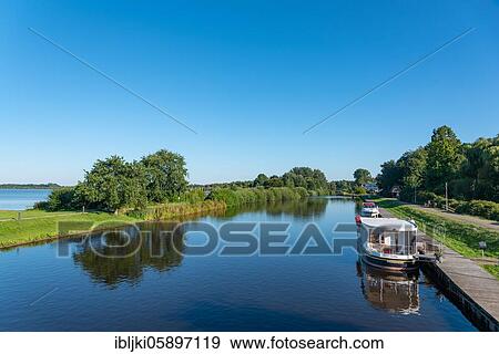 Stock Photo - Houseboat on the Elbe-Weser shipping route, Bad Bederkesa, Lower Saxony, Germany, Europe. Fotosearch