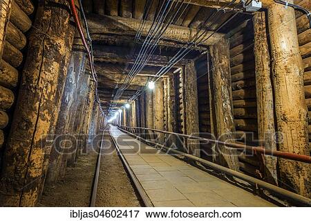 Stock Photo - Illuminated underground tunnel in old salt mine, Bochnia, Poland, Europe. Fotosearch