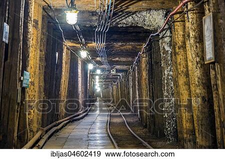 Illuminated underground tunnel in old salt mine, Bochnia, Poland, Europe View Large Photo Image Stock Photo - Illuminated underground tunnel in old salt mine, Bochnia, Poland, Europe. Fotosearch