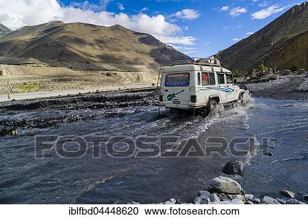 Jeep taxi is crossing a river, Josom, Kali Gandaki valley, Mustang District, Nepal, Asia View Large Photo Image Stock Image - Jeep taxi is crossing a river, Josom, Kali Gandaki valley, Mustang District, Nepal, Asia. Fotosearch
