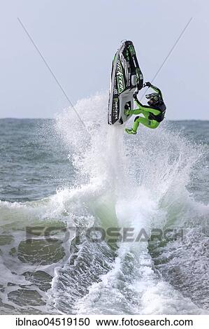 Stock Image - Jet Ski driver in wave, Stunt, Atlantic Ocean, Portugal, Europe. Fotosearch