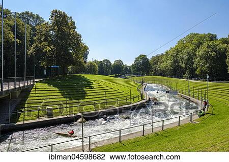Stock Image - Kayaker on Augsburger Eiskanal, Spickel, Augsburg, Swabia, Bavaria, Germany, Europe. Fotosearch