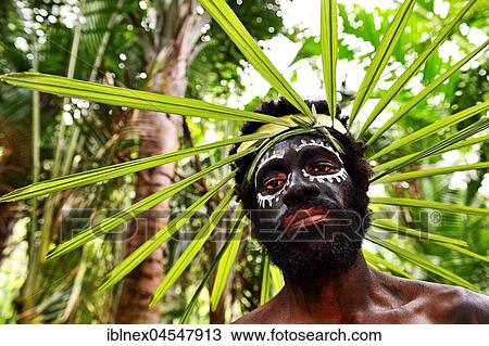 Korafe man with face painting and headdress made of leaves, McLaren-Harbour, Tufi, Papua New Guinea, Oceania View Large Photo Image Stock Image - Korafe man with face painting and headdress made of leaves, McLaren-Harbour, Tufi, Papua New Guinea, Oceania. Fotosearch