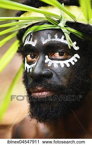 Korafe-Man with facial painting and headdress made of leaves, portrait, McLaren-Harbour, Tufi, Papua New Guinea, Oceania View Large Photo Image Stock Image - Korafe-Man with facial painting and headdress made of leaves, portrait, McLaren-Harbour, Tufi, Papua New Guinea, Oceania. Fotosearch