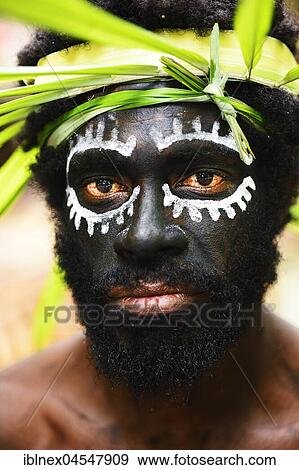 Korafe-Man with facial painting and headdress made of leaves, portrait, McLaren-Harbour, Tufi, Papua New Guinea, Oceania View Large Photo Image Stock Photo - Korafe-Man with facial painting and headdress made of leaves, portrait, McLaren-Harbour, Tufi, Papua New Guinea, Oceania. Fotosearch