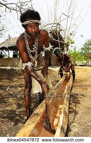 Korafe men, edit tree out for embarkation, boat building, Yavi Village, Tufi, Papua New Guinea, Oceania View Large Photo Image Stock Image - Korafe men, edit tree out for embarkation, boat building, Yavi Village, Tufi, Papua New Guinea, Oceania. Fotosearch