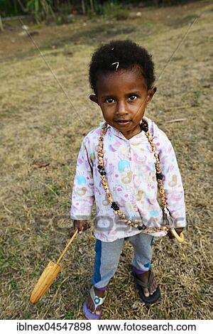 Korafe tribe, child with wooden toy paddle, Korafe tribe, Tufi, Papua New Guinea, Oceania View Large Photo Image Stock Photo - Korafe tribe, child with wooden toy paddle, Korafe tribe, Tufi, Papua New Guinea, Oceania. Fotosearch