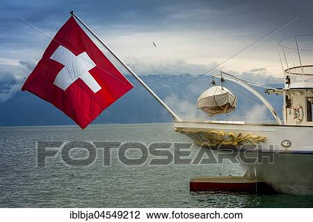 Stock Image - La Suisse paddle steamer on Lake Geneva with Swiss flag, Canton of Vaud, Switzerland, Europe. Fotosearch