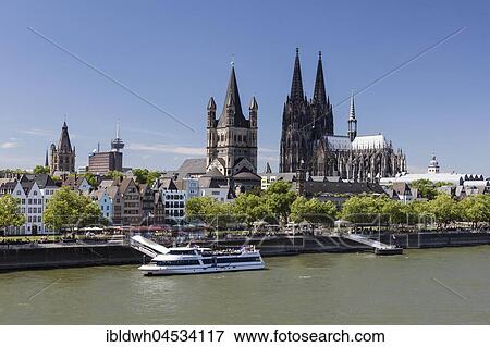 Stock Photo - Landing bridge on the Rhine bank, with town hall, cathedral, church Groß St. Martin, Cologne, North Rhine-Westphalia, Germany, Europe. Fotosearch