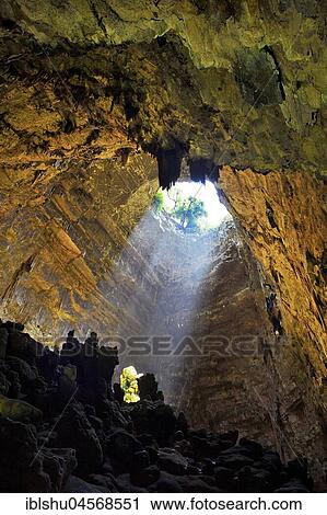 Light cone in the entrance area of the cave of Castellana Cave, Castellana Grotto, Province of Bari, Puglia, Italy, Europe View Large Photo Image Stock Image - Light cone in the entrance area of the cave of Castellana Cave, Castellana Grotto, Province of Bari, Puglia, Italy, Europe. Fotosearch