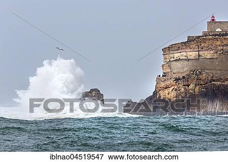 Lighthouse Farol de Nazare, high waves, Nazare, Portugal, Europe View Large Photo Image Stock Photo - Lighthouse Farol de Nazare, high waves, Nazare, Portugal, Europe. Fotosearch
