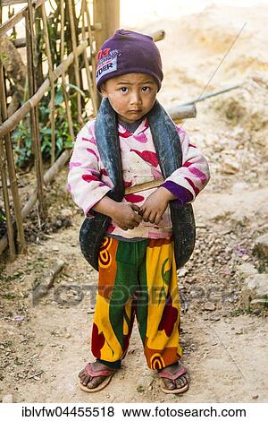 Little boy with inner tube of tire as toys around neck, Palaung hilltribe, Palaung Village in Kyaukme, Shan State, Myanmar, Asia View Large Photo Image Stock Photo - Little boy with inner tube of tire as toys around neck, Palaung hilltribe, Palaung Village in Kyaukme, Shan State, Myanmar, Asia. Fotosearch